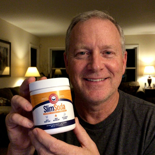 Customer holding a jar of SlimSoda