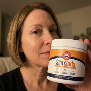 Customer holding a jar of SlimSoda