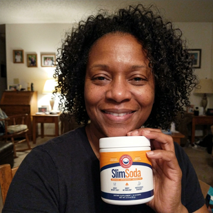 Customer holding a jar of SlimSoda