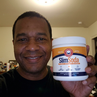 Customer holding a jar of SlimSoda
